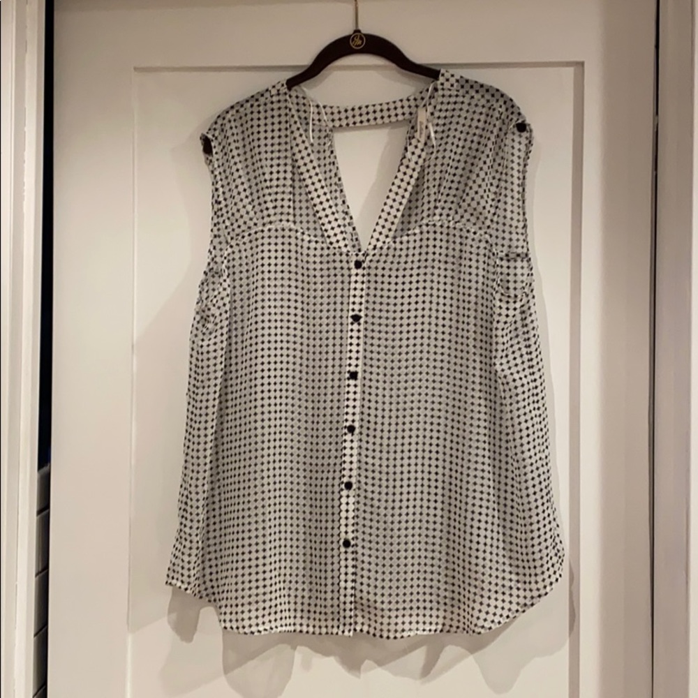 Sheer blouse with key hole detail.